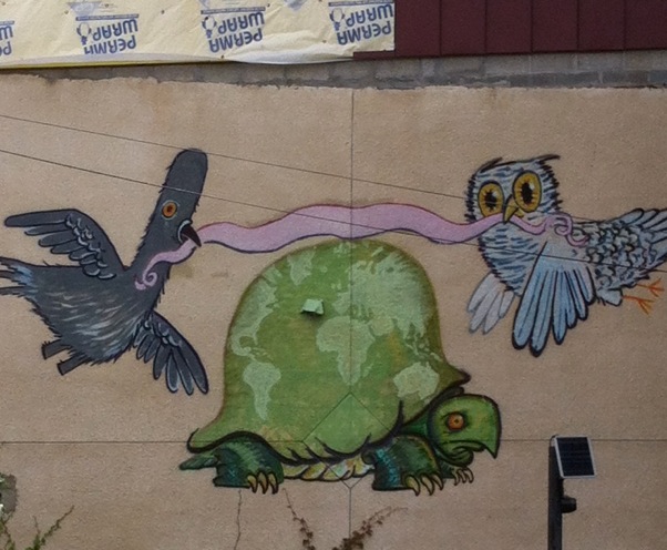 The Tortoise crossing the tape.