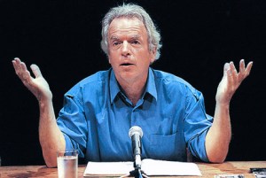 Spalding Gray and his entire stage setting